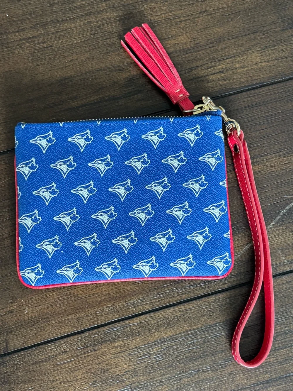 Dooney & Bourke Blue Wristlet with Red Trim and Tassel
